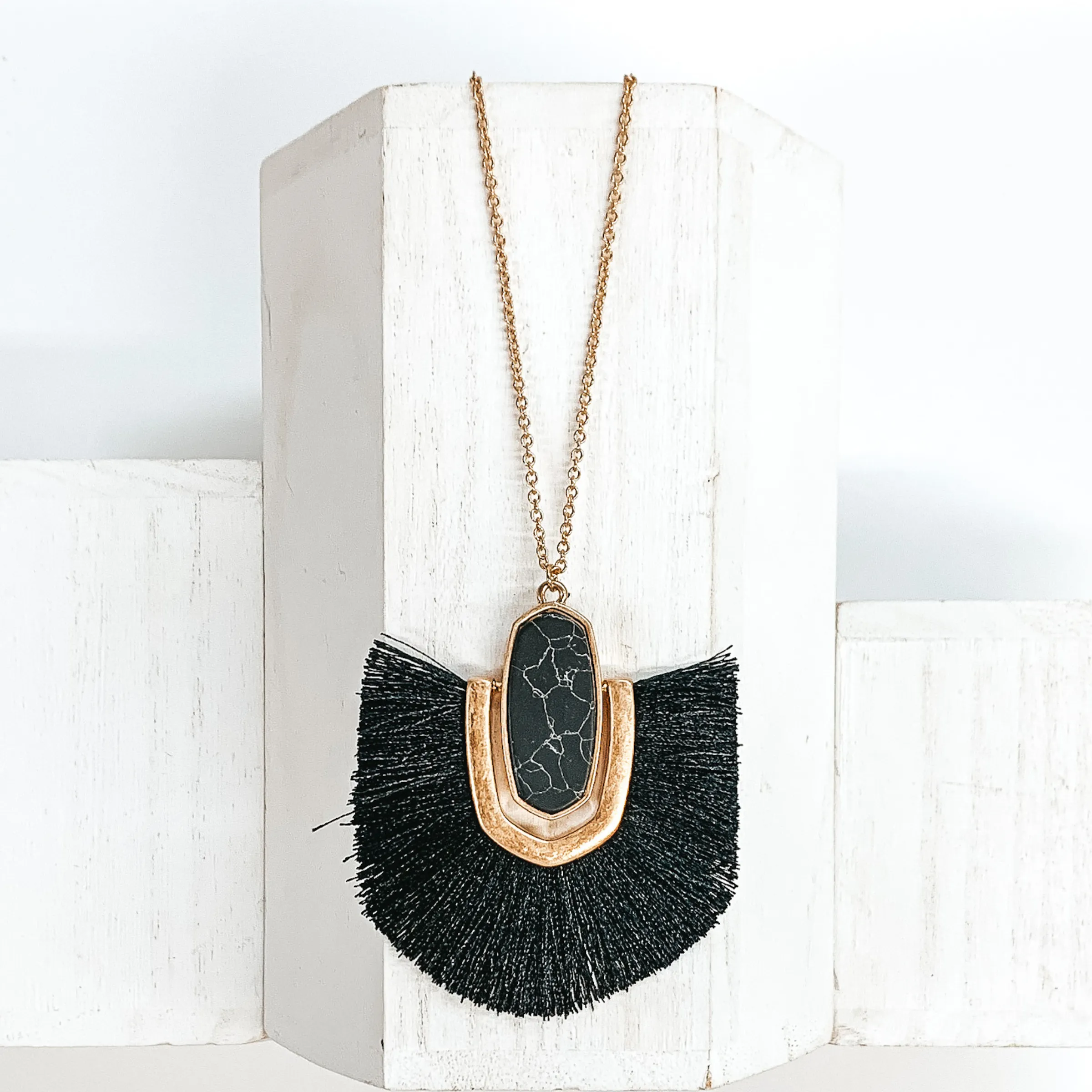 Long Gold Chain Necklace with a Semi Precious Oval Pendant and Fringe in Black