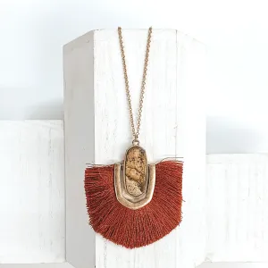 Long Gold Chain Necklace with a Semi Precious Oval Pendant and Fringe in Rust